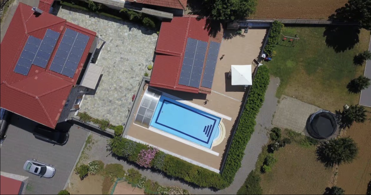 6×12 m heated pool from above Aerial drone view of the 6 by 12 metre heated pool with retractable enclosure at Villa Arcadia