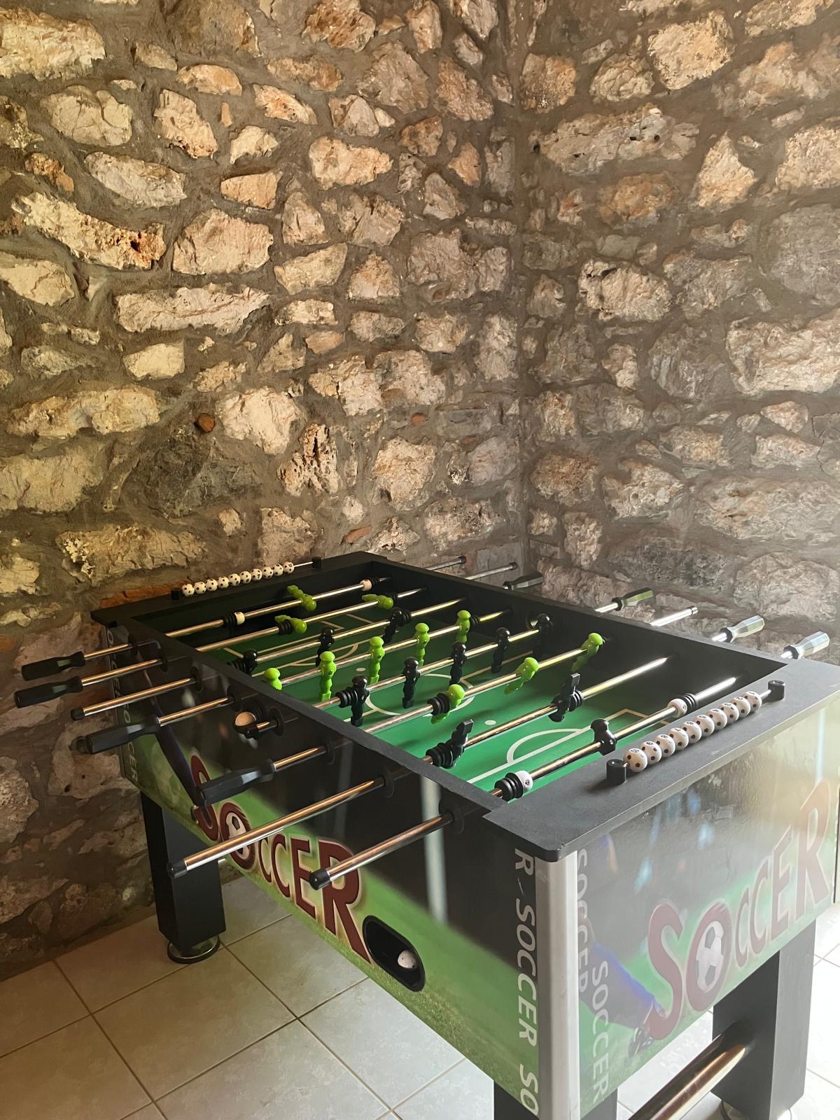 Foosball in the pool house Foosball / futsal table in the stone-walled game room at Villa Arcadia
